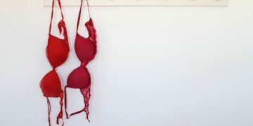 Red bras hanging on rack Red bras hanging on rack
